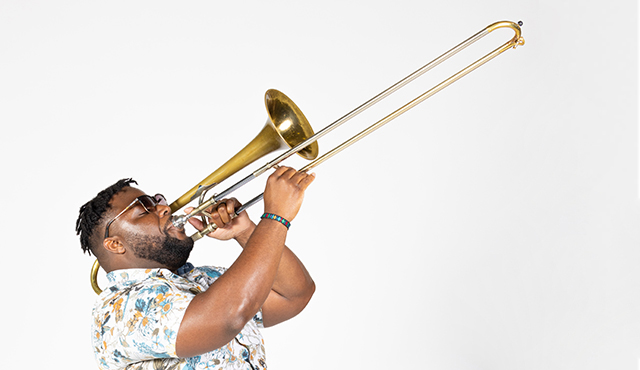 Brandon T. Bryant plays the trombone